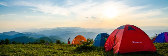 Three tents on a mountain top